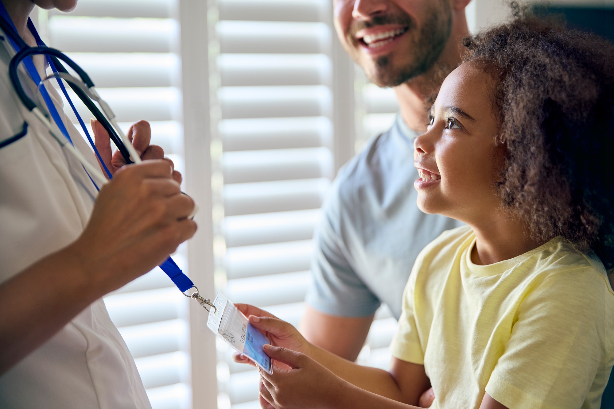 Close Up Of Girl Looking At Nurse's Security Lanyard